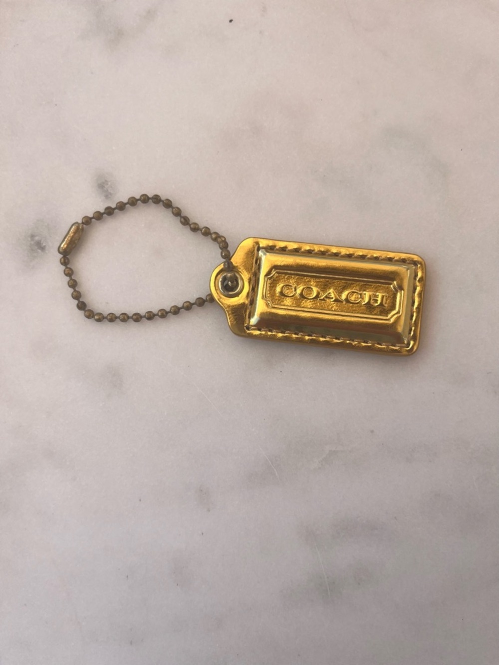 COACH Vintage Leather Hang Tag. Mirrored Gold